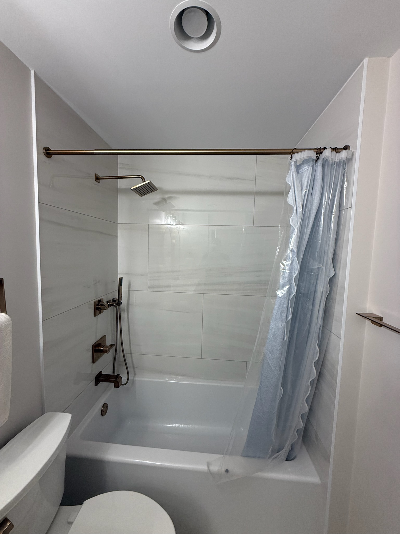 Guest bathroom remodel in Simpsonville, SC with porcelain tile floor, solid-wood double vanity, and quartz top - Ketner family photo 1