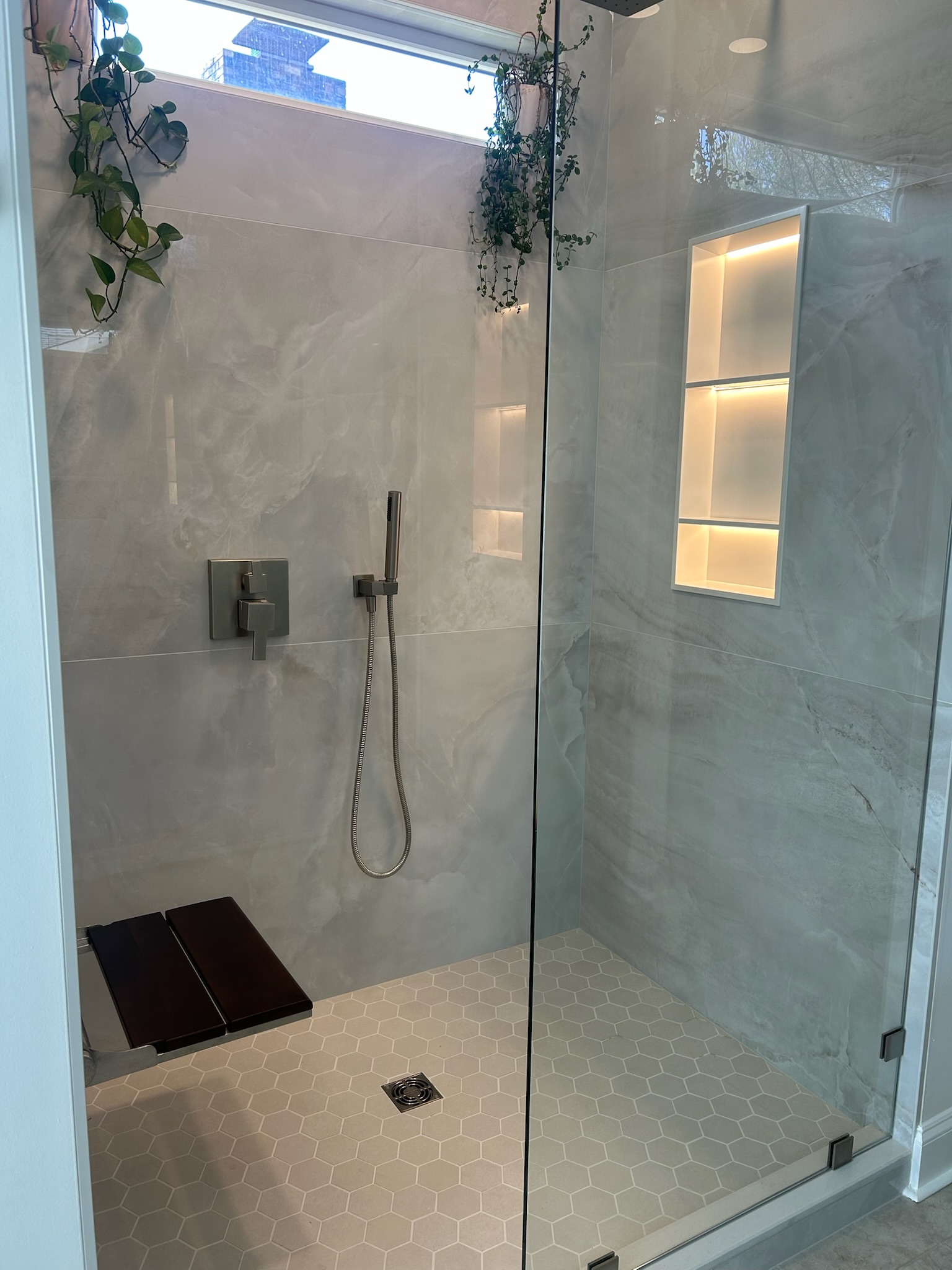 Bathroom vanity and shower refresh in Upstate, SC with modern vanity, quartz-style top, and matte black accents - Sandra project photo 1