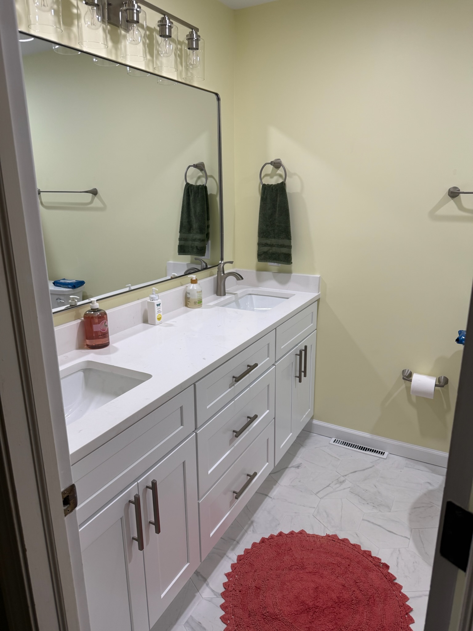 White shaker double vanity with white quartz countertop and brushed nickel fixtures in Upstate SC bathroom